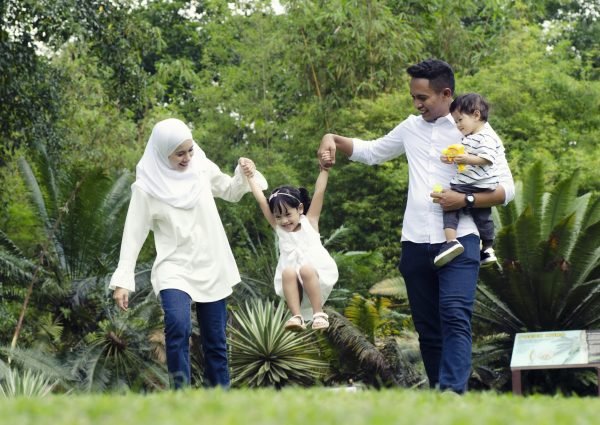 happy family concept with enjoying expression face,having fun at public park.